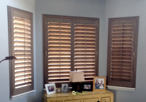 bay window nook of bedroom with hardwood shutters on window in Englewood CO