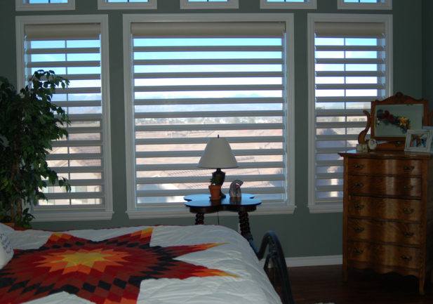 bedroom with pirouette window shades in Englewood CO