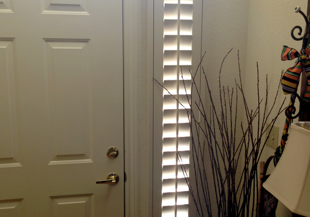 entryway door side windows with white shutters in Westminster CO home