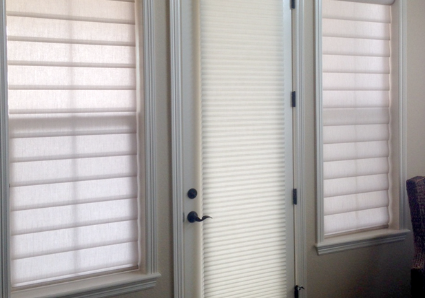 pirouette shades and cellular shades on entryway door and windows in Centennial CO