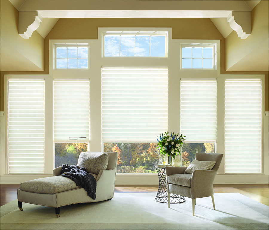 soft white roman shades on living room windows in Westminster CO