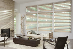 full view of living room with large windows covered with pirouette window shades in Westminster CO