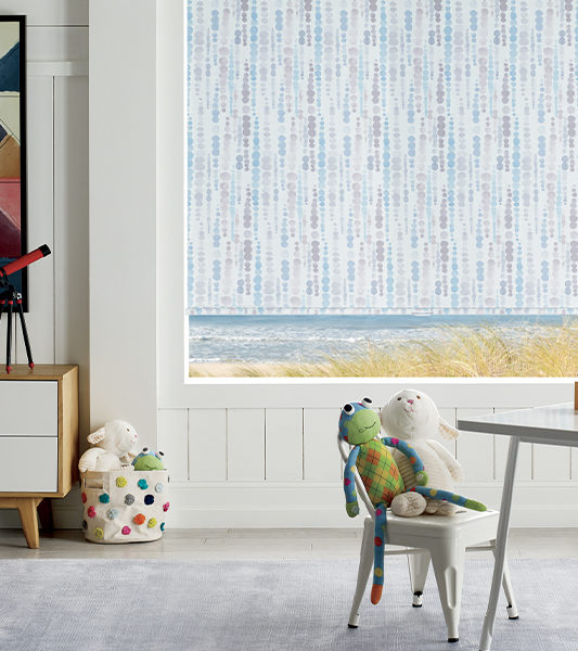 blue patterned roller shades in playroom as cordless window coverings Englewood CO