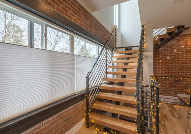 exposed brick hardwood staircase automated blinds duette honeycomb top down bottom up shades Denver 80206