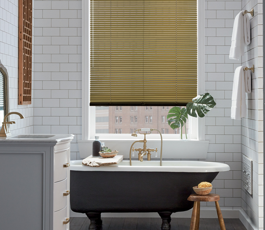 bathroom window with gold metal blinds and white subway tile wall Denver CO