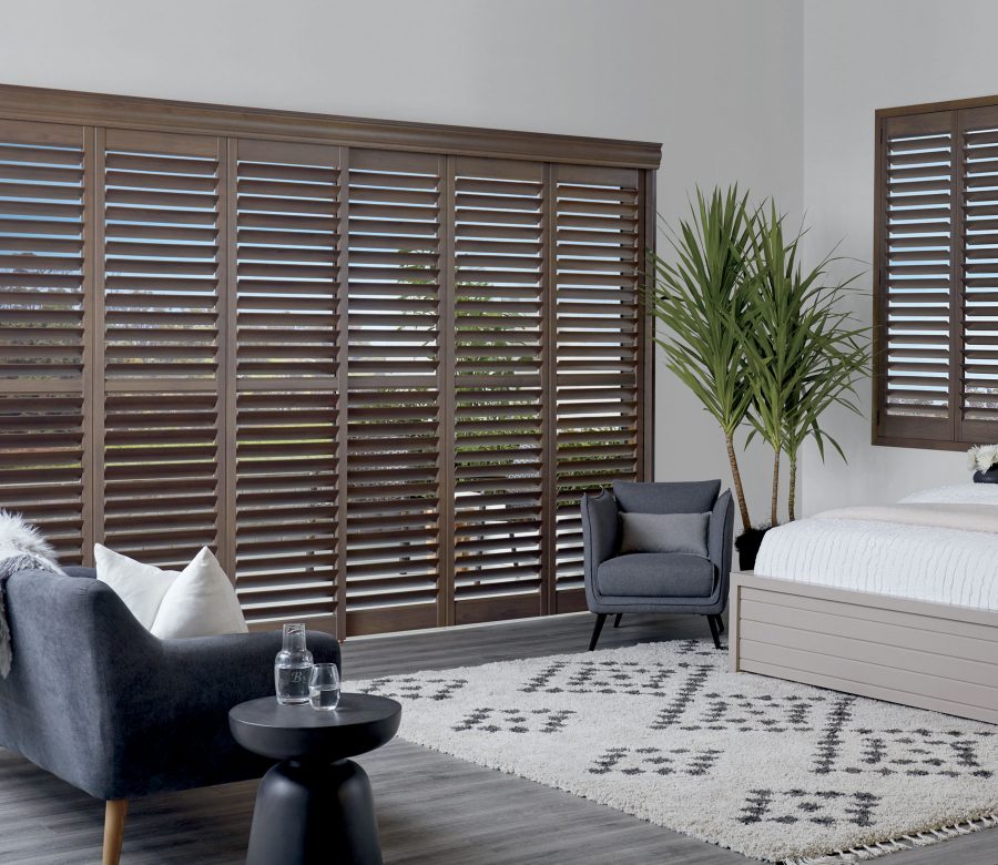 Dark wood plantation shutters on sliding doors inin Denver CO