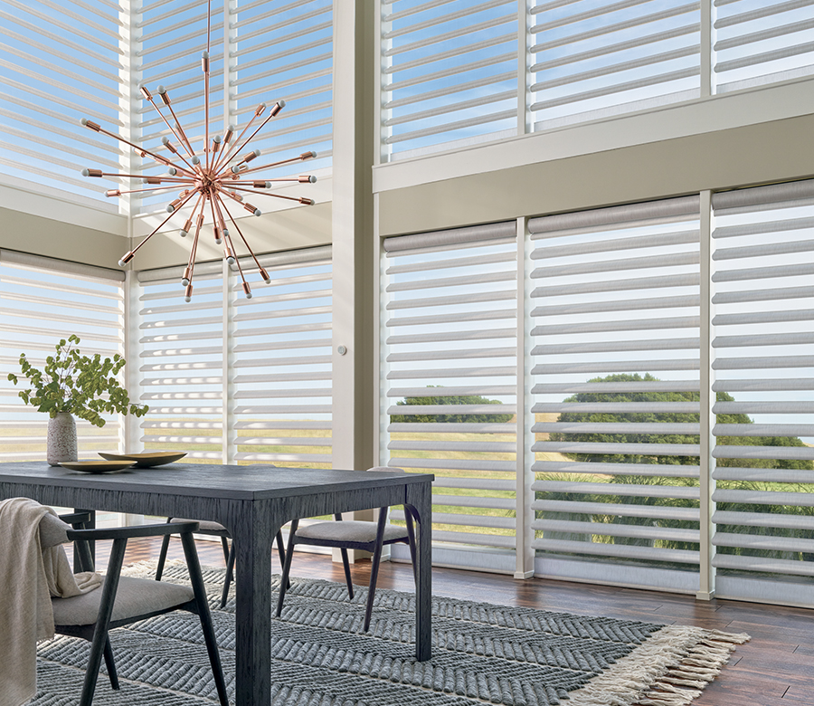 dining room with hard to reach windows and motorized shades Westminster CO