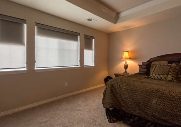dual roller shades in bedroom for room darkening in Denver home