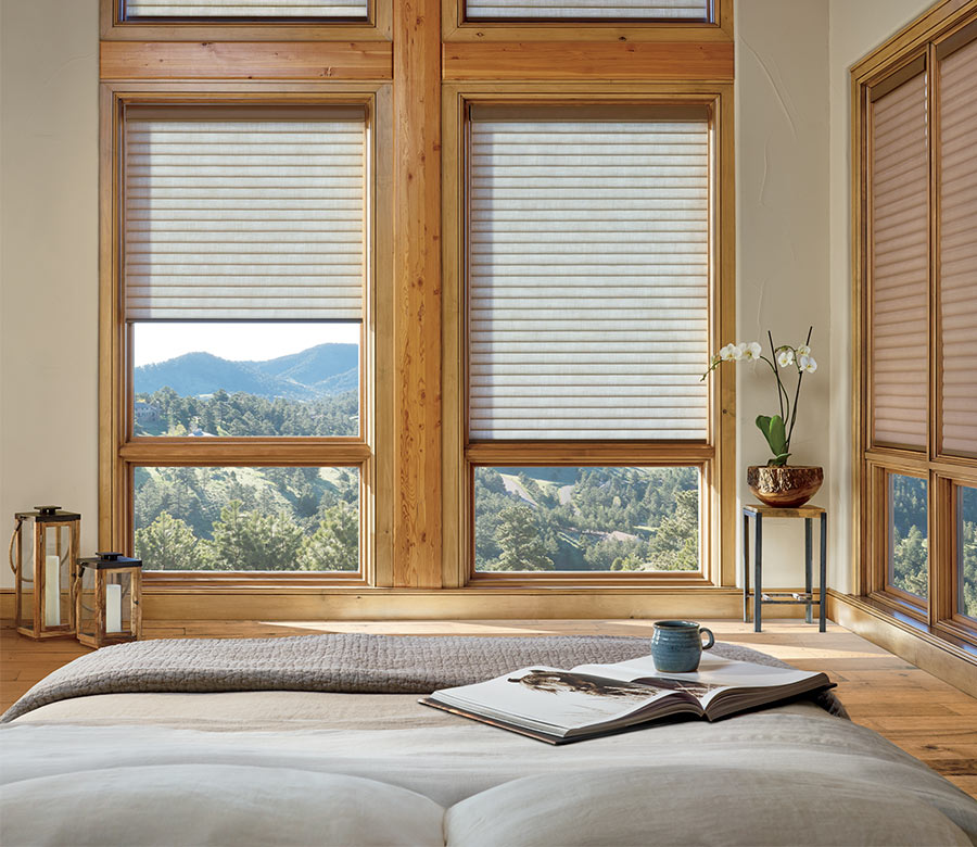 bedroom with cellular roller shades on hard to reach windows in Denver CO