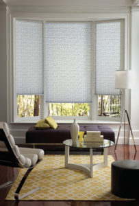 spring decorating style trends with patterned shades on bay window