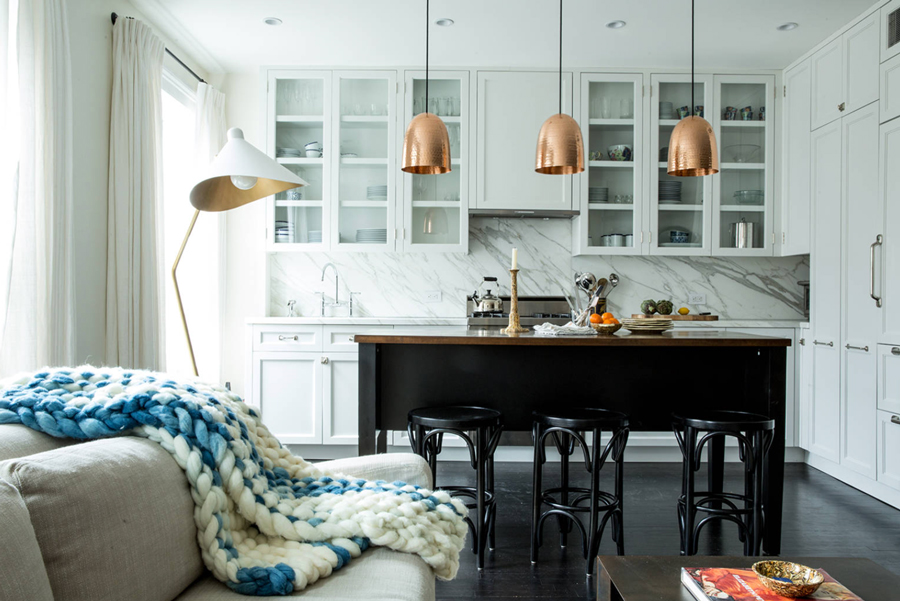 copper pendants above kitchen in contemporary condo 