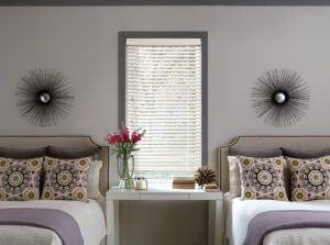 bedroom patterns with double beds window with white blinds in Westminster CO