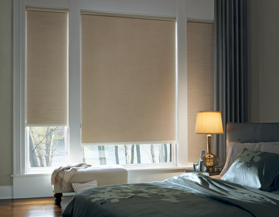 beautifully decorated bedroom room darkening roller shades Hunter Douglas Westminster 80021