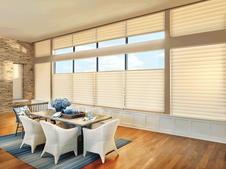 dining room with large windows covered with custom roman shades top down bottom up shades Denver CO