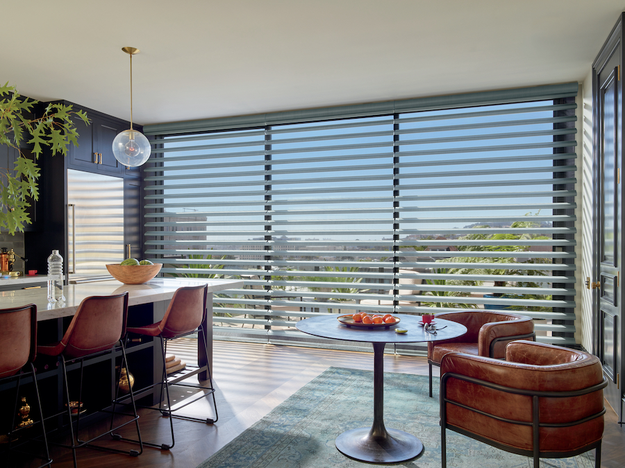 Floor to ceiling windows with sheer shades.