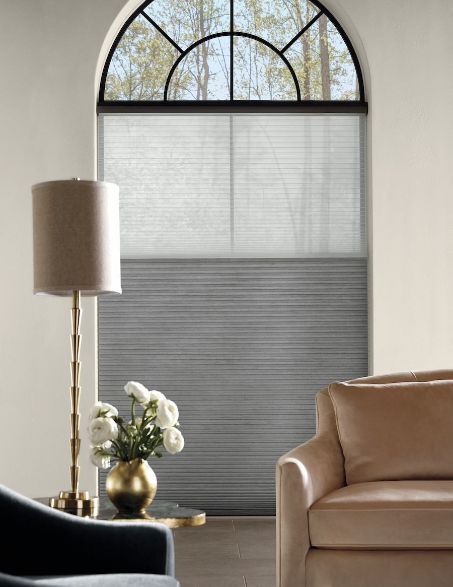 honeycomb shades cover black trim windows