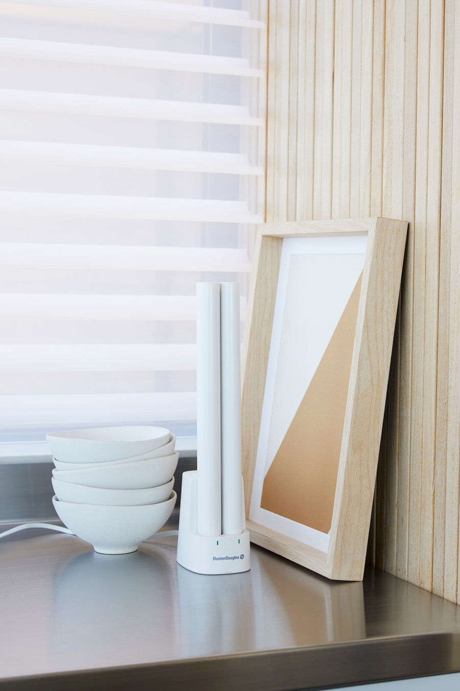 Hunter Douglas rechargeable battery wand on charging station for motorized shades