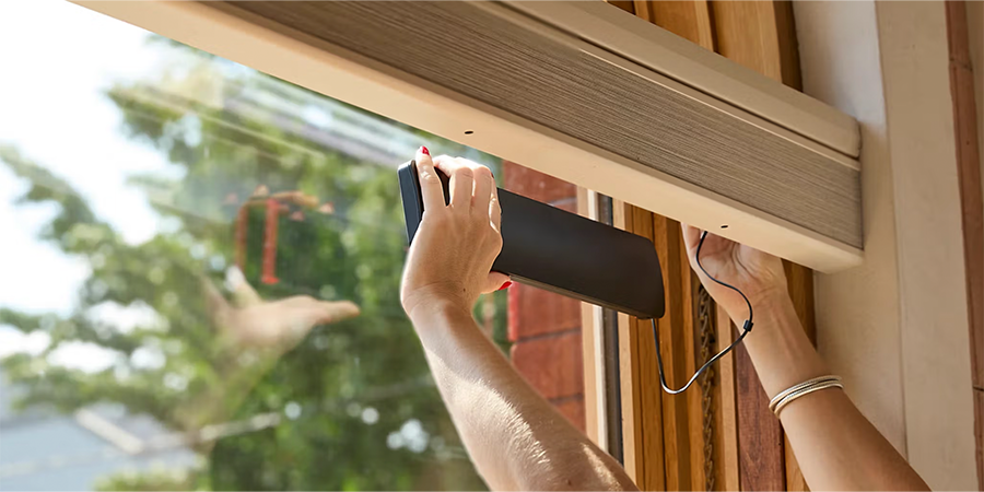 PowerView Solar Charger connected to a rechargeable battery wand for Hunter Douglas motorized shades