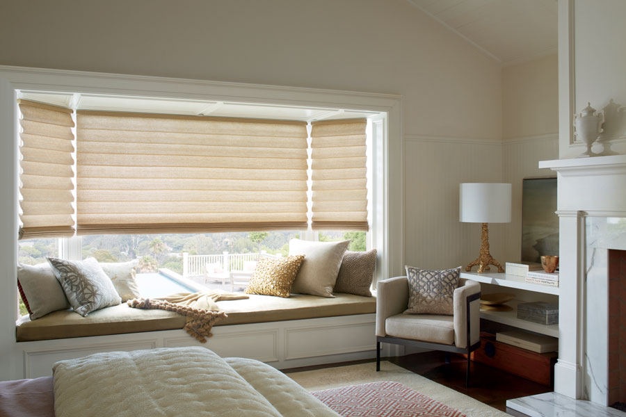 Bay window with vignette roman shades in bedroom Denver, CO