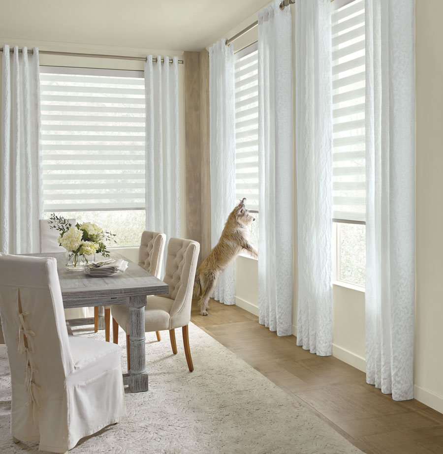 Dining room with designer banded shades