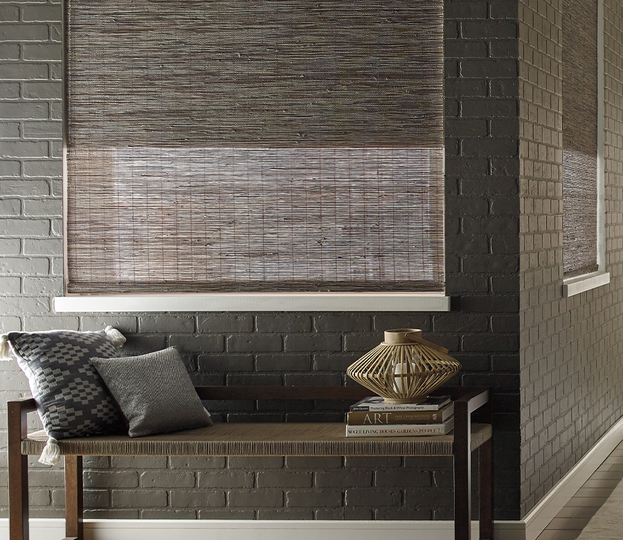 dark woven wood shades with gray painted brick walls in Stapleton, CO