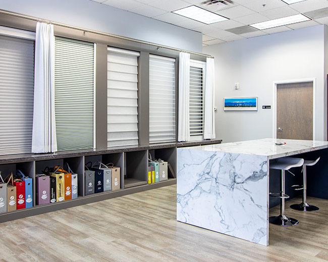 waterfall countertop and dual opacity window shades in colorado showroom