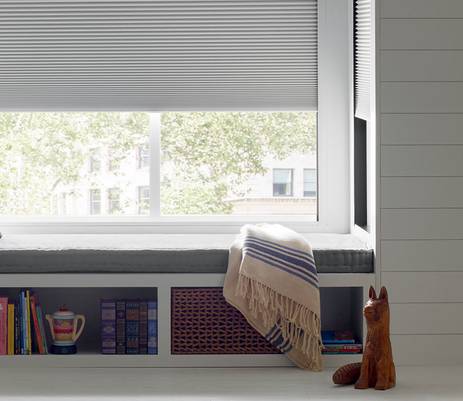 cozy window bench with room darkening lightlock window shades by Hunter Douglas