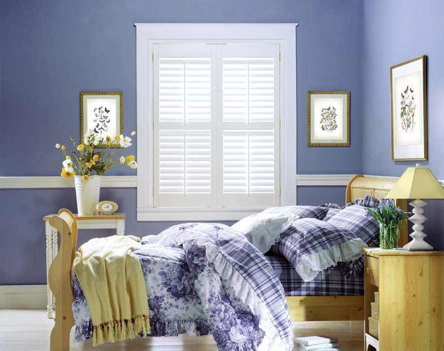 white shutters in bedroom with periwinkle colored walls 