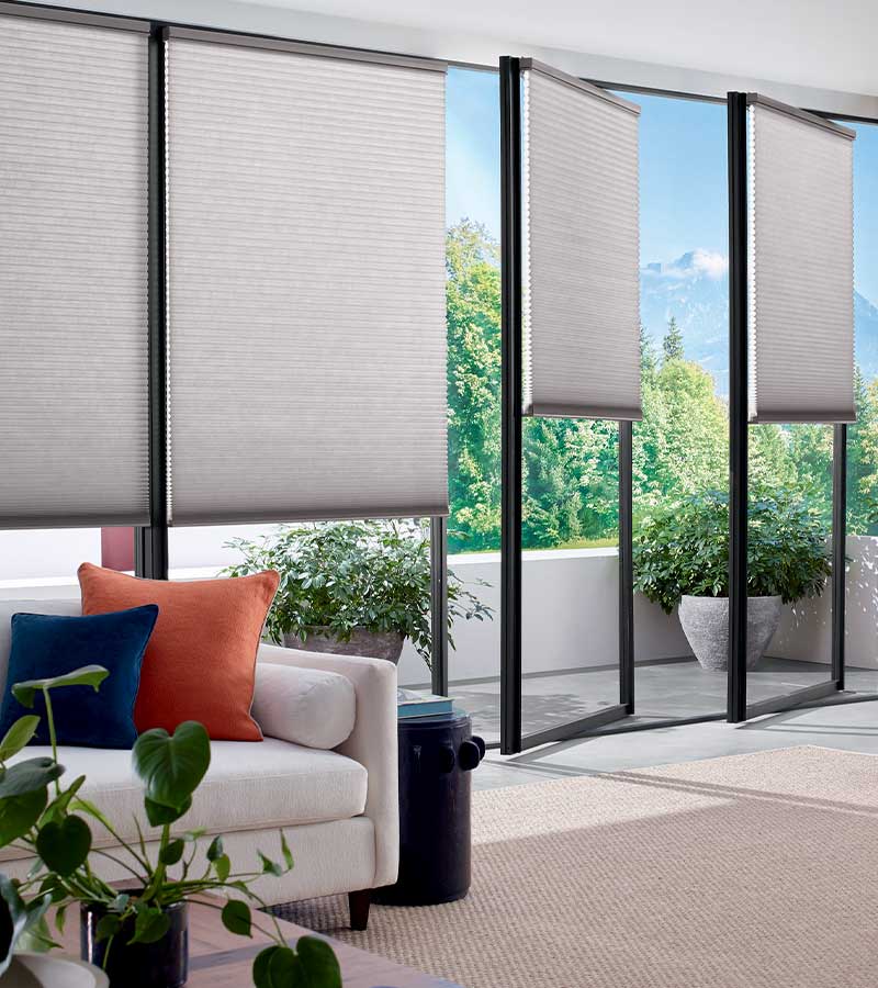 All glass patio doors covered with cellular energy efficient window shades, Hunter Douglas window treatments for doors in Denver, CO