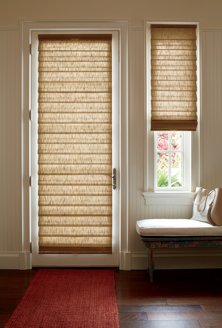 roman shades on entryway door also covering narrow sidelight window