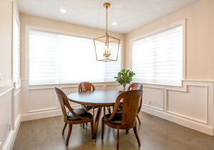 Centennial home with sheer shades on dining room windows