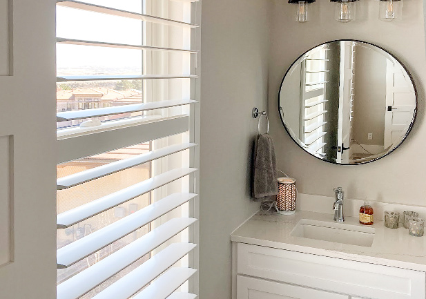 white bathroom shutter for privacy in Denver, CO home