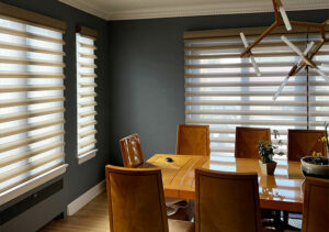 automated sheer fabric shades in formal dining room