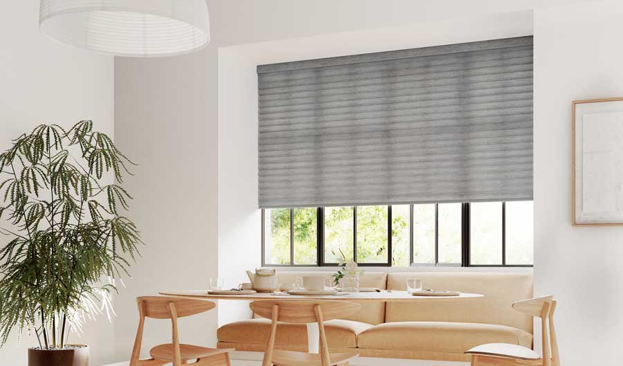 Eat in area with gray blinds covering dark trim windows