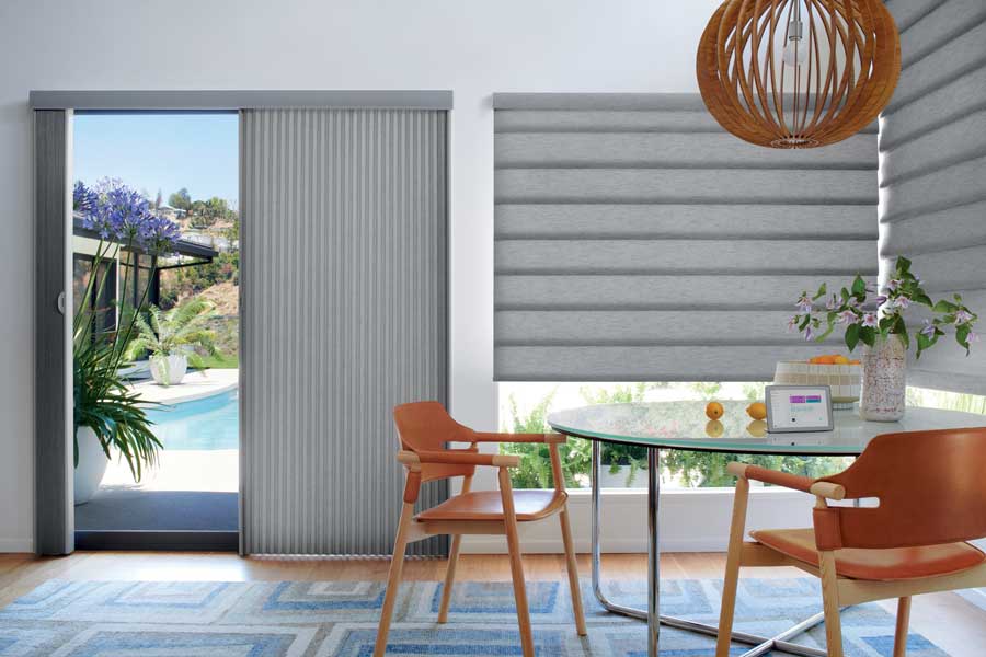 gray roman shades with hanging basket pendant in an open floor plan home