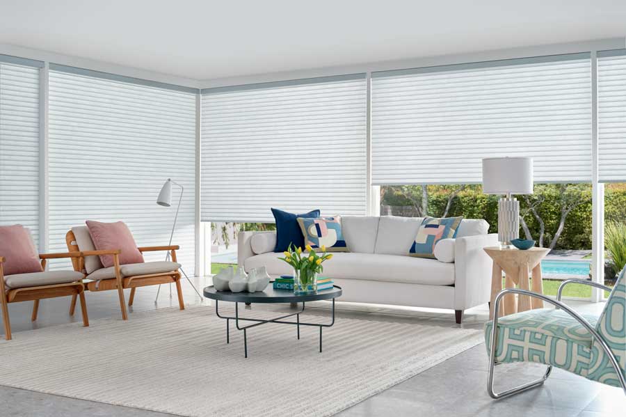 gray cellular roller shades in an open floor plan home