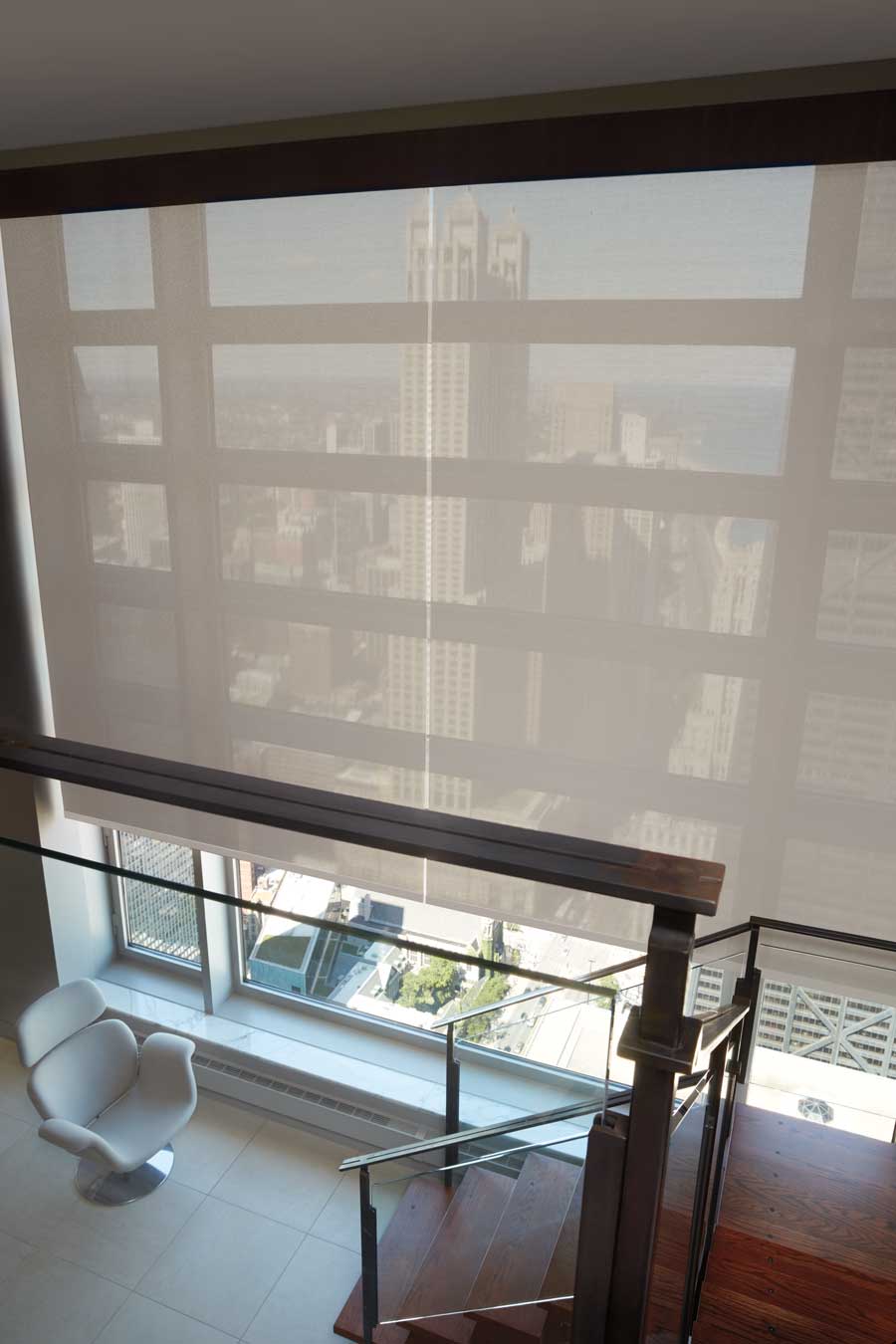 screen shades on large staircase windows in Denver