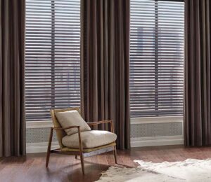 mahogany color blinds framed by dark brown drapery panels