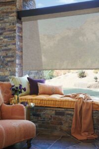 Alustra® Woven Textures in a cozy, jewel-toned nook overlooking a backyard