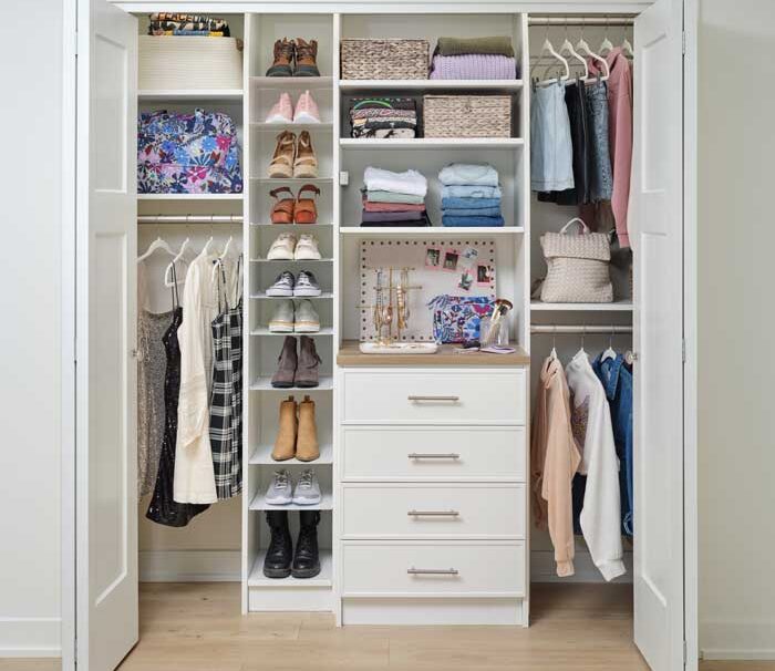 reach in closet in Denver with custom closet features drawers, hang bars, shelving