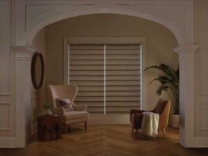 room darkening roman shades on large windows in sitting room