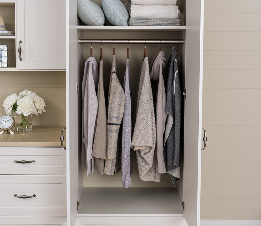 open closet doors with hanging in custom closet in Hilltop CO