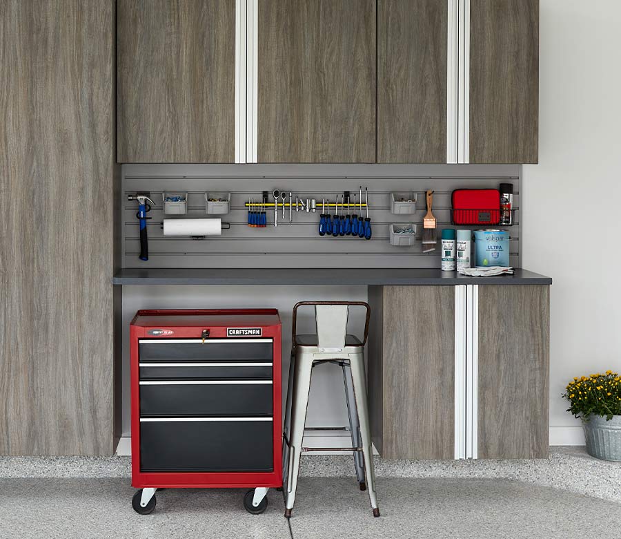 custom garage organization with cabinets and tool equipment in Belcaro CO