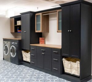 laundry room custom storage system in dark black wood