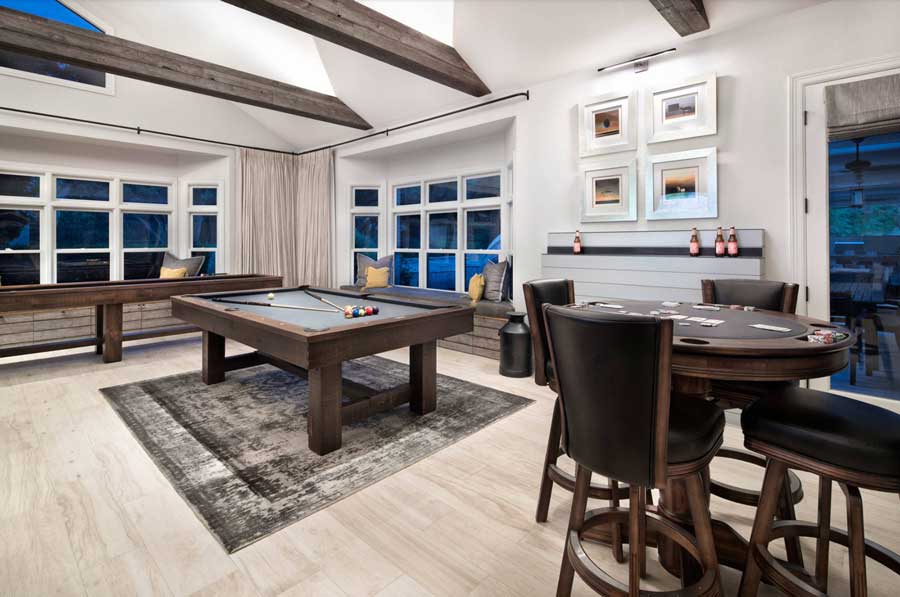 game room with pool table and card table