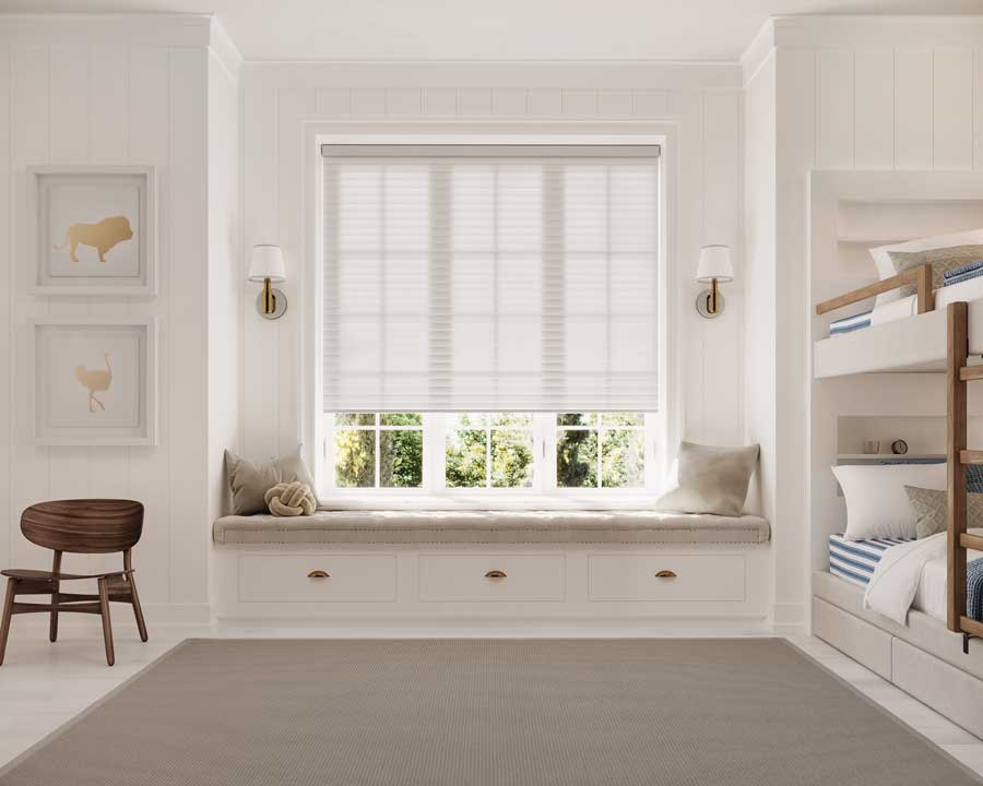 child's bedroom with bunk beds and window seating with cellular roller shades in Denver