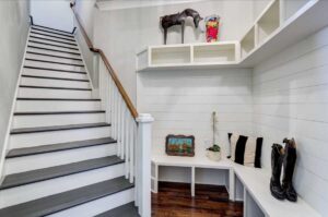 functional mudroom area bottom of the stairs