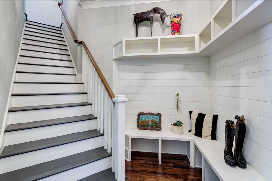 functional mudroom area bottom of the stairs