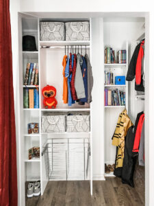 custom closet with adjustable shelves and hamper basket for school age child