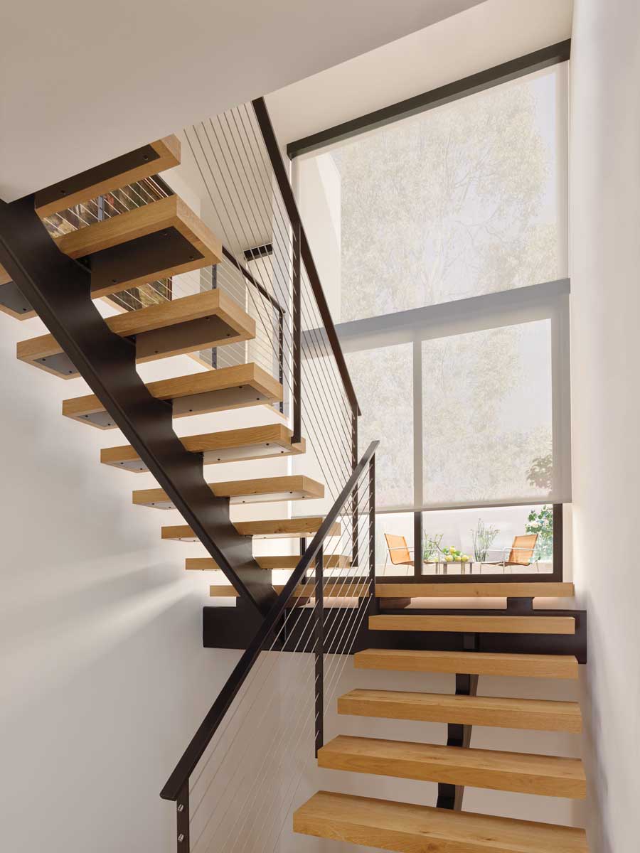 large motorized screen shade on a staircase rocky mountain shutters shades and closets